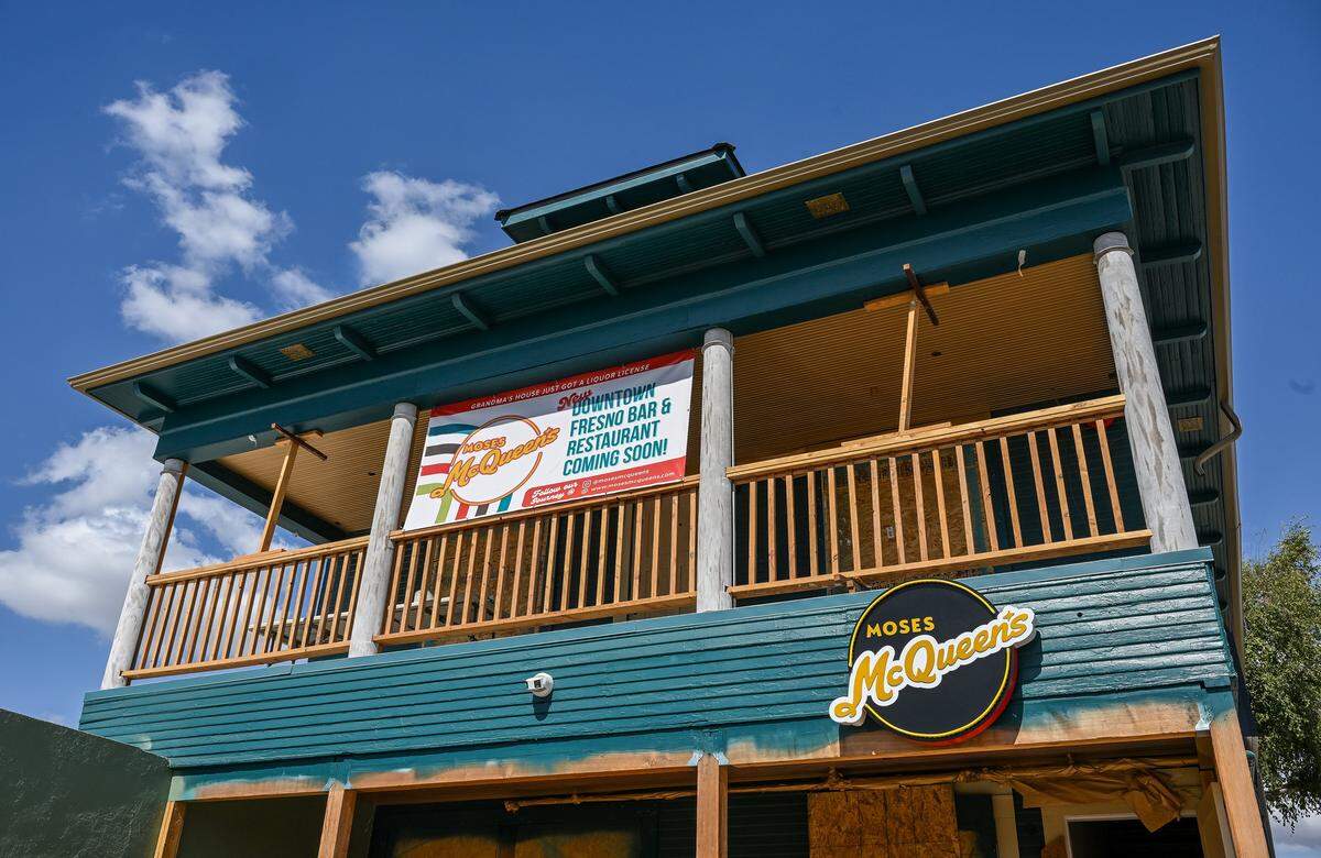 A banner hangs on the building that will be Moses McQueen's restaurant and bar in downtown Fresno.The restaurant is located in a home originally owned by Armenian immigrants.