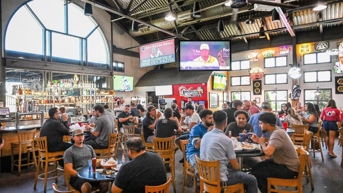 Guests can order at the front counter or get table service in the bar area at Dog House Grill. The restaurant is entirely self-seating so it can be challenging to find a table during busy times.