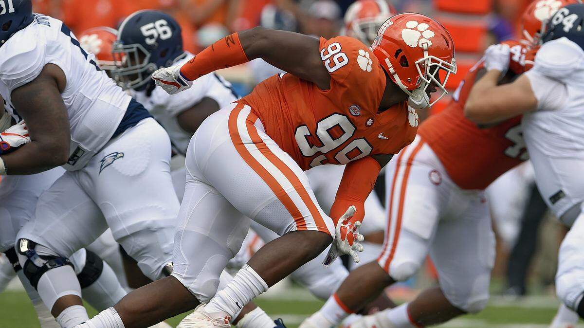 FILE - In this Sept. 15, 2018, file photo, Clemson’s Clelin Ferrell (99) rushes into the backfield during the first half of an NCAA college football game against Georgia Southern, in Clemson, S.C. Ferrell was selected fourth overall.