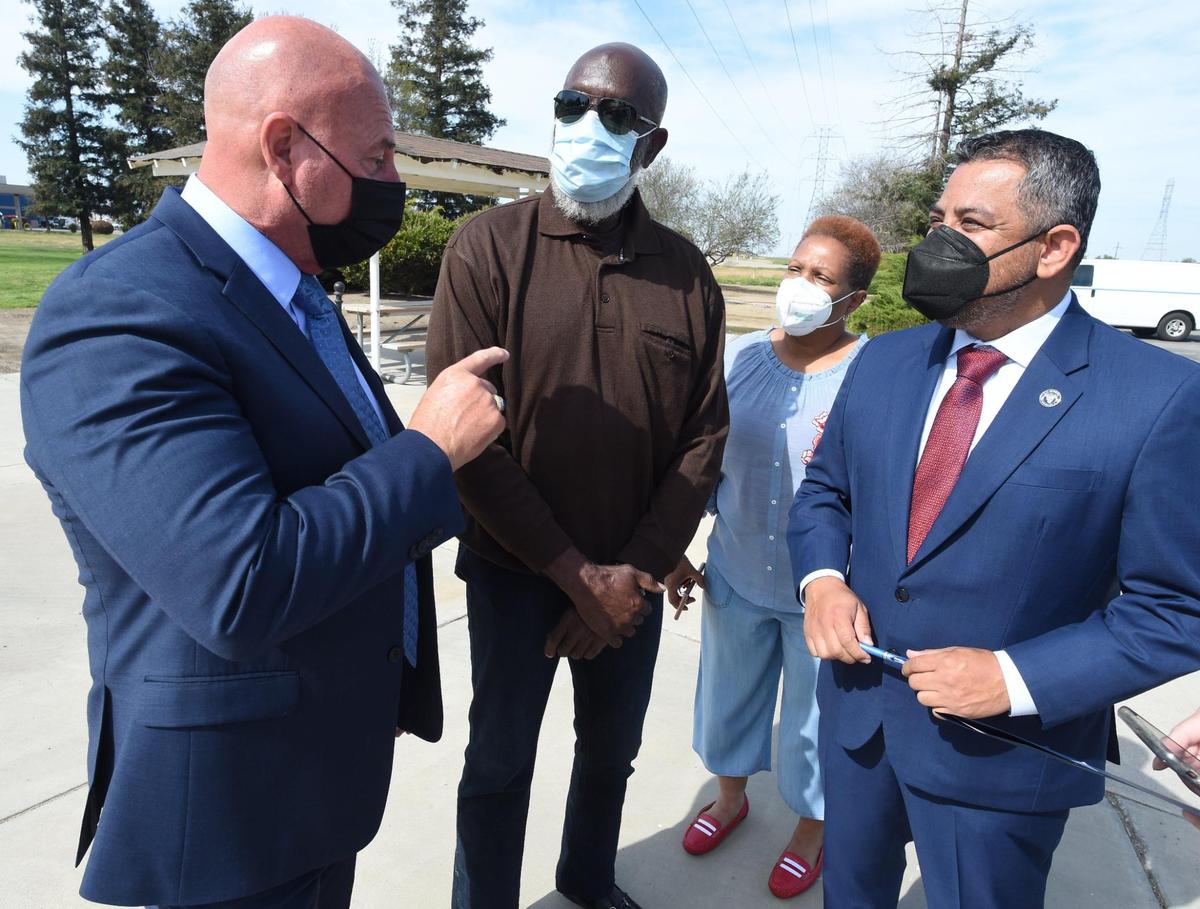 Fresno Mayor Jerry Dyer, left, talks with Bob Mitchell and Debbie Darden, leaders of the Golden Westside Planning Committee, at center, and Fresno City Councilmember Miguel Arias, during a news conference, April 7, 2021, at the Fresno Clovis Regional Wastewater Reclamation Facility.