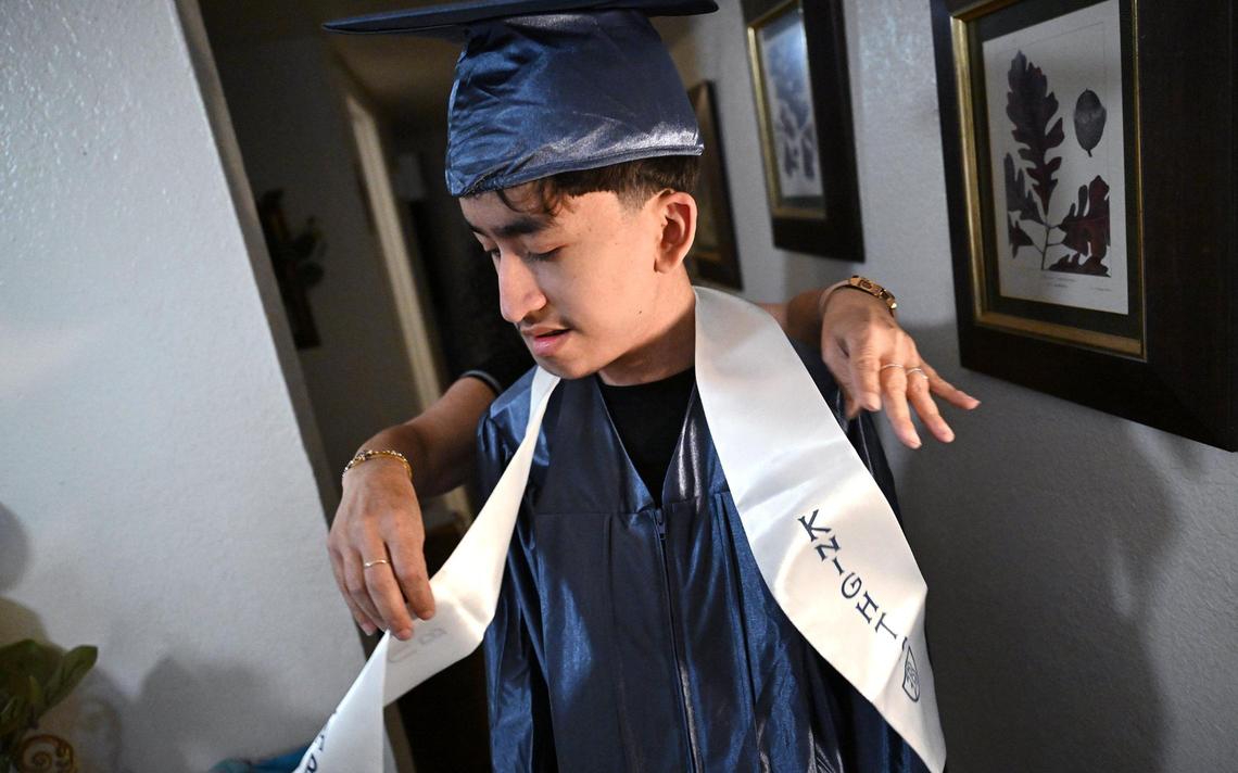Maria Alvarado, background, helps adjust her son Cruz Hernandez’s sash which he will wear while graduating from Bullard High School that evening. Cruz and his mother talk about their trip to Washington DC to advocate for Medical which helped pay for Cruz’ fight against a rare disease.