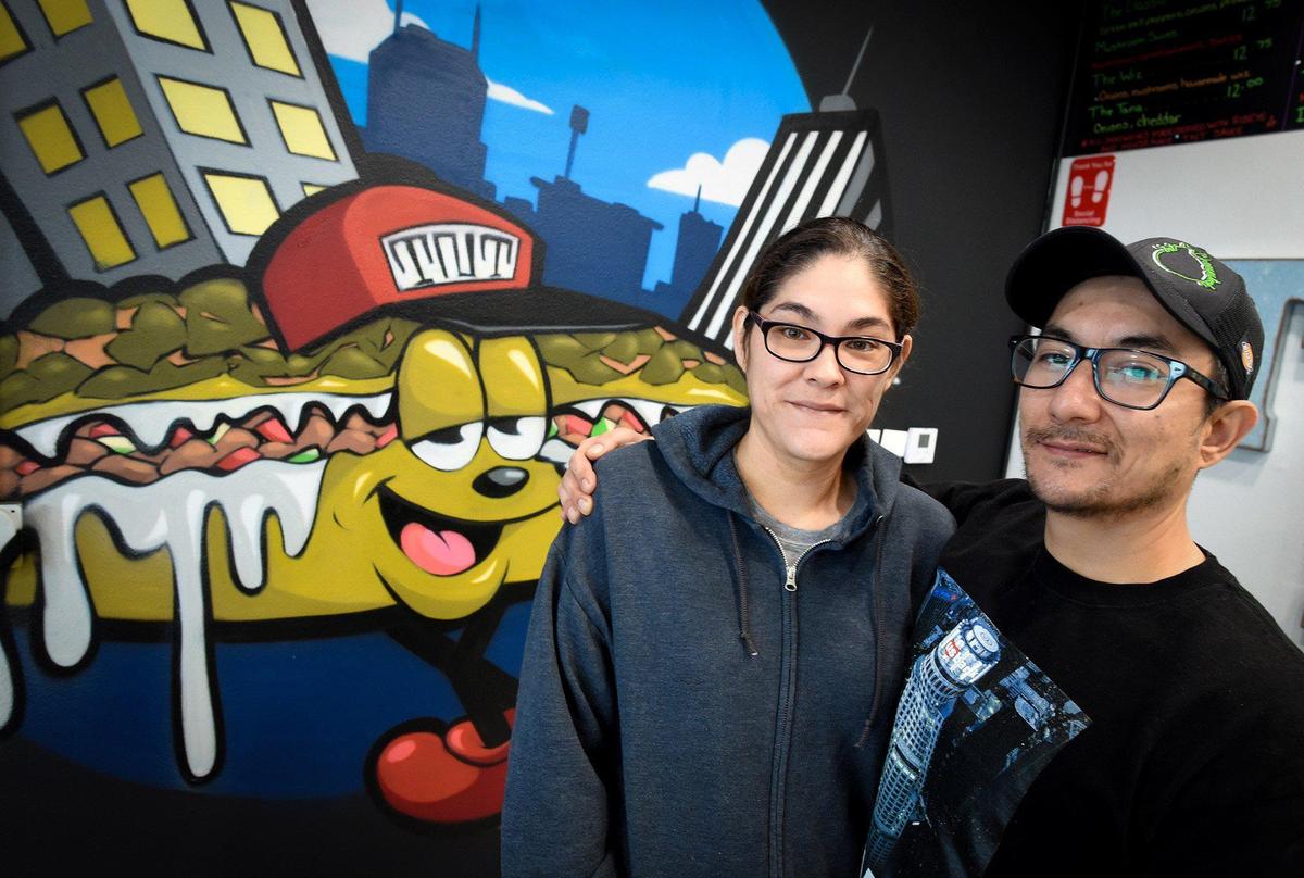 Santana “Tana” Vargas and Valentino “Tino” Lee, owners of TNT Cheesesteaks outside their Ashlan Avenue restaurant, which closed earlier this year.