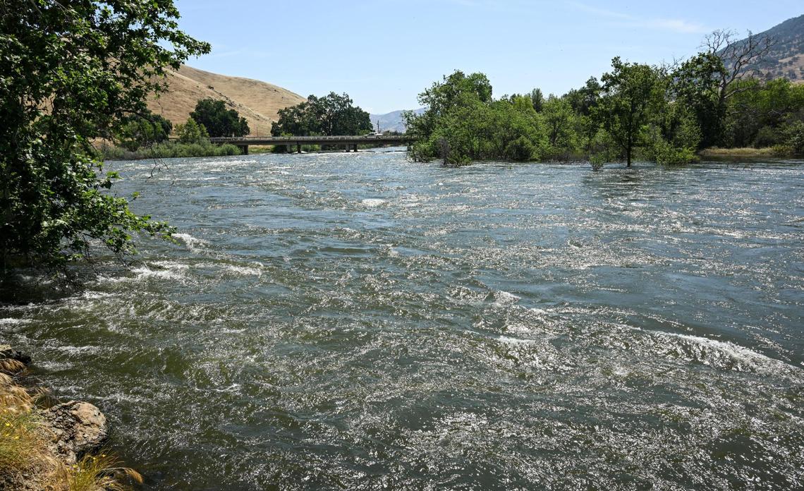 The Kings River near Winton Park is running very high and fast due to increased releases out of Pine Flat Reservoir as engineers work to make space for the heavy snow melt in the Sierra Nevada, on Monday, May 22, 2023. The Fresno County Sheriff’s Office has closed the Kings River due to dangerously high water levels.