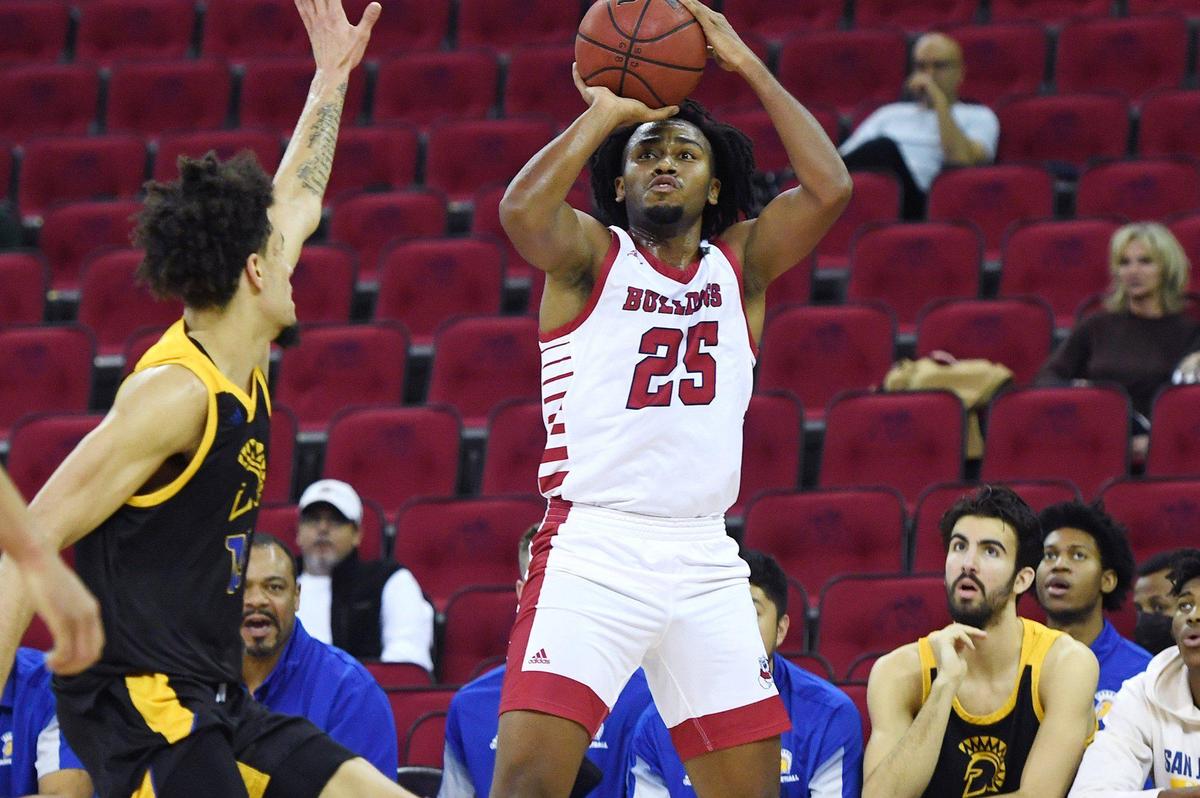 Fresno State forward Anthony Holland gets a shot over San Jose State’s Trey Anderson in the Bulldogs’ 79-59 victory over the Spartans Tuesday night, Jan. 11, 2022 in Fresno. Holland scored a career-high 20 points with 11 rebounds and five assists.