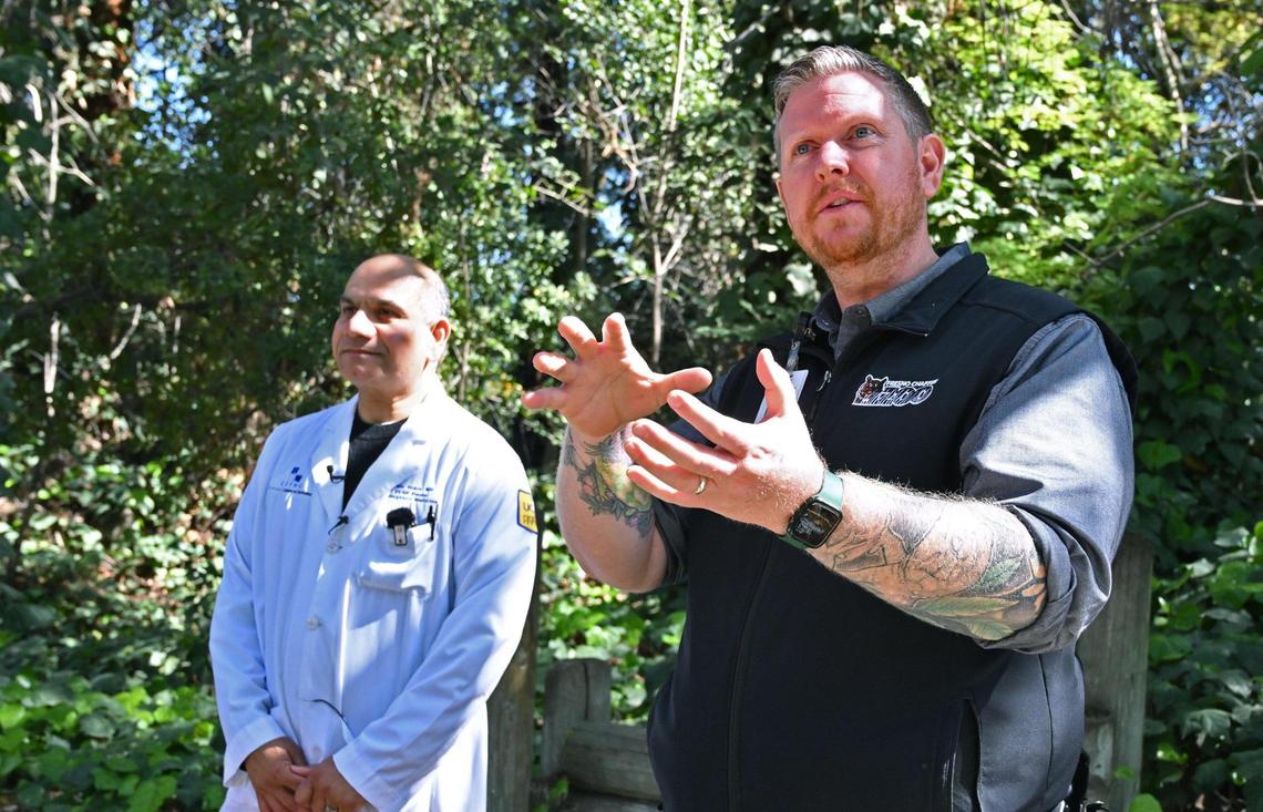 Dr. Rais Vohra of California Poison Control stands to the left as Steven Sharp, Zoological Animal Manager for the Fresno Chaffee Zoo cautions about rattlesnake encounters during an exhibition at the Fresno Chaffee Zoo Friday. March 22, 2024 in Fresno.
