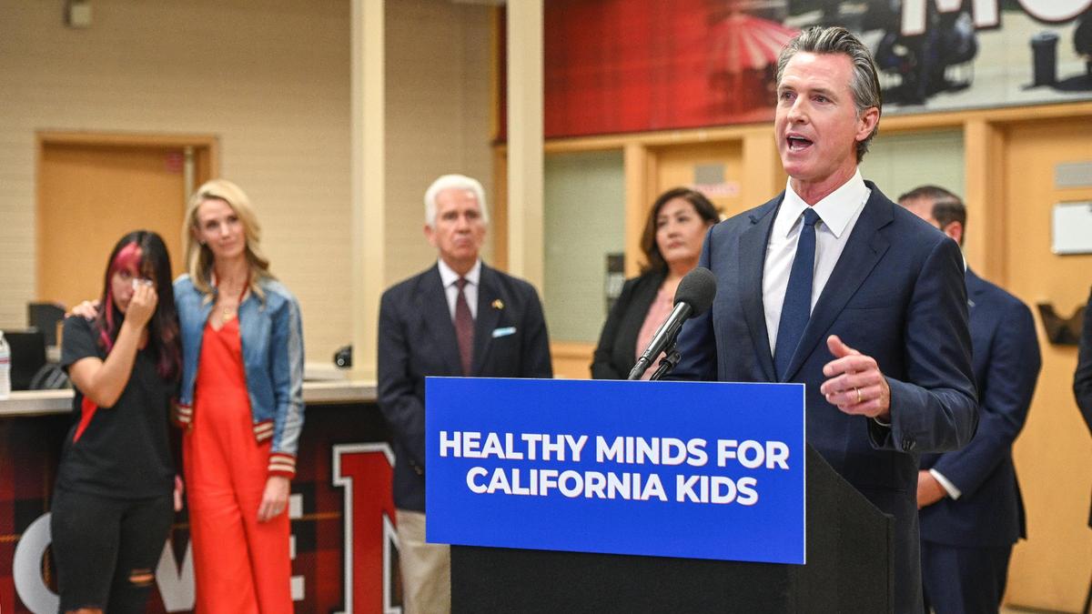 Gov. Gavin Newsom gives a press conference to announce new funding for mental health and substance abuse support for young Californians, during a visit to McLane High School in Fresno on Thursday, Aug. 18, 2022.
