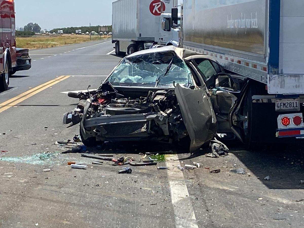 Multiple rear-end collsions, including one that pushed a Chevrolet into the undercarriage of a big rig, shut down Highway 41 south of Fresno Monday afternoon.