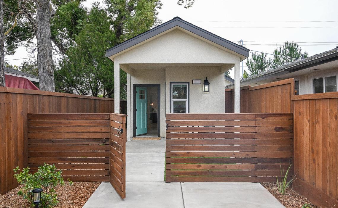 A recently finished accessory dwelling unit or ADU sits next to the main house on a lot in Fresno neighborhood. Property owner Brandon Telesmanic had the home built as a rental property which is a growing trend in Fresno.