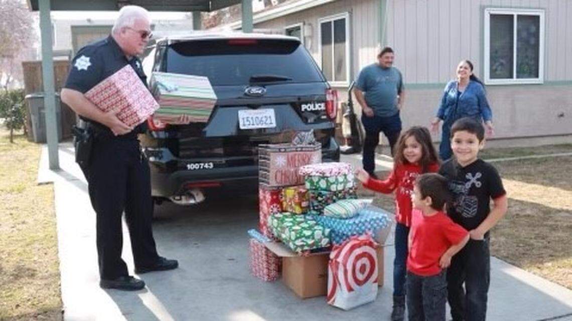 Fresno Police shared this undated photo of officer Steven Hunt delivering Christmas presents. Hunt was killed in a bicycle crash near Shaver Lake on Saturday, July 30, 2022.