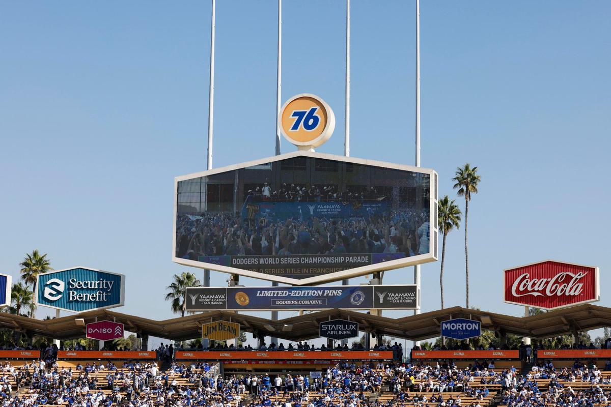 Fans watch the Los Angeles Dodgers parade before the Los Angeles Dodgers World Series Victory Ceremony at Dodger Stadium in Los Angeles, California, USA, 01 November 2024.