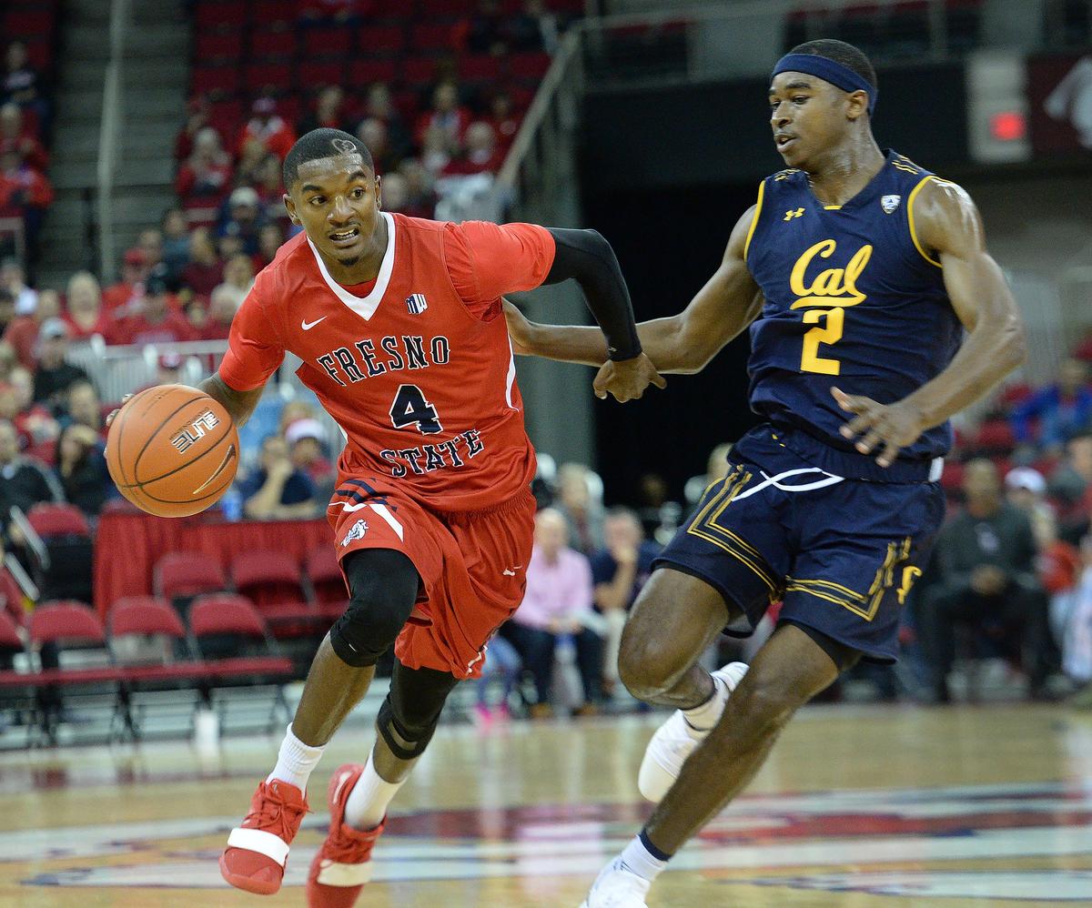 Fresno State guard Braxton Huggins, left, tries to drive past Cal’s Juhwan Harris-Dyson during the Bulldogs’ 95-73 victory over the Golden Bears at the Save Mart Center on Wednesday, Dec. 19, 2018. The win was the Bulldogs’ sixth in a row.