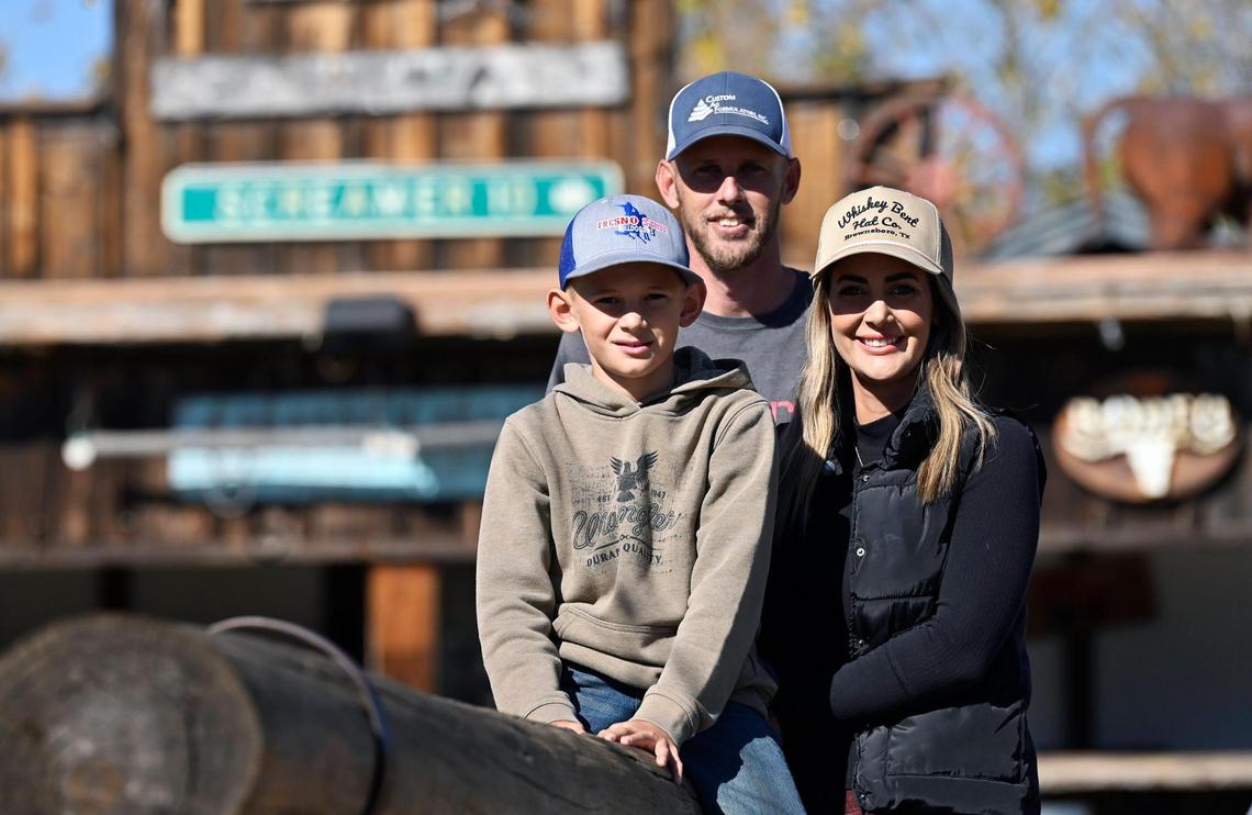 Kaleb Stweard, 10, poses with his parents Ryan and Melissa Steward, Friday, Nov. 8, 2024 near Coarsegold. The Stewards have purchased the Coarsegold Rodeo Grounds and have plans for its future.