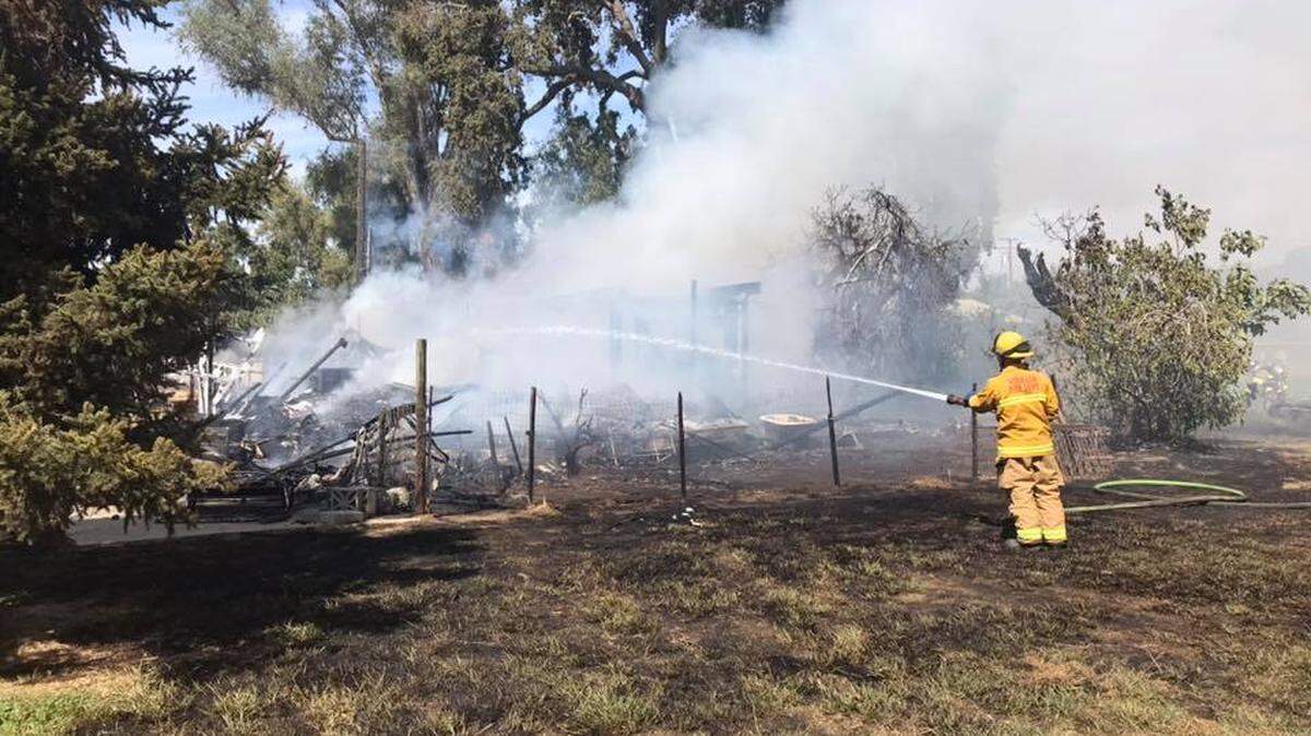 A female suffered injuries after a mobile home caught on fire Saturday afternoon in Tulare County.