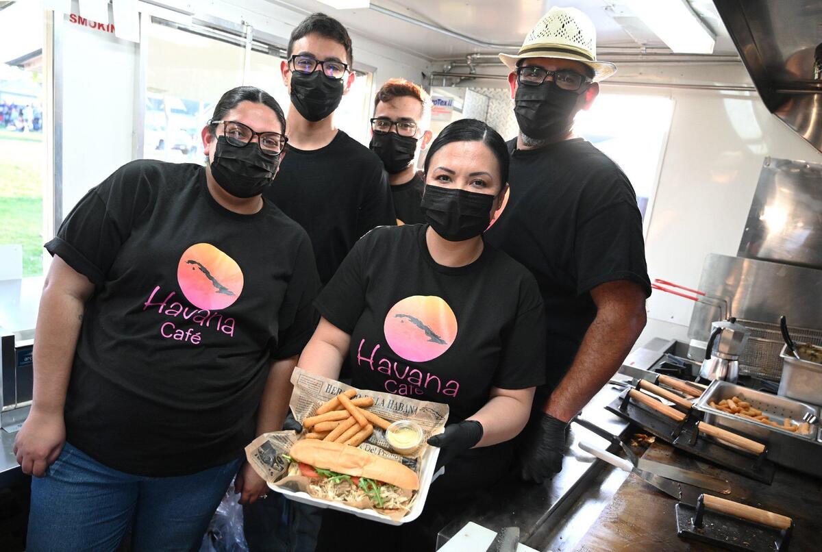 Niermin Saldana, center, and her husband Lazaro Saldana, far right, have opened a food truck with family members specializing in the Cuban food and coffee Lazaro remembers as a child called Havana Cafe. Photographed Wednesday, March 16, 2022 in Fresno.