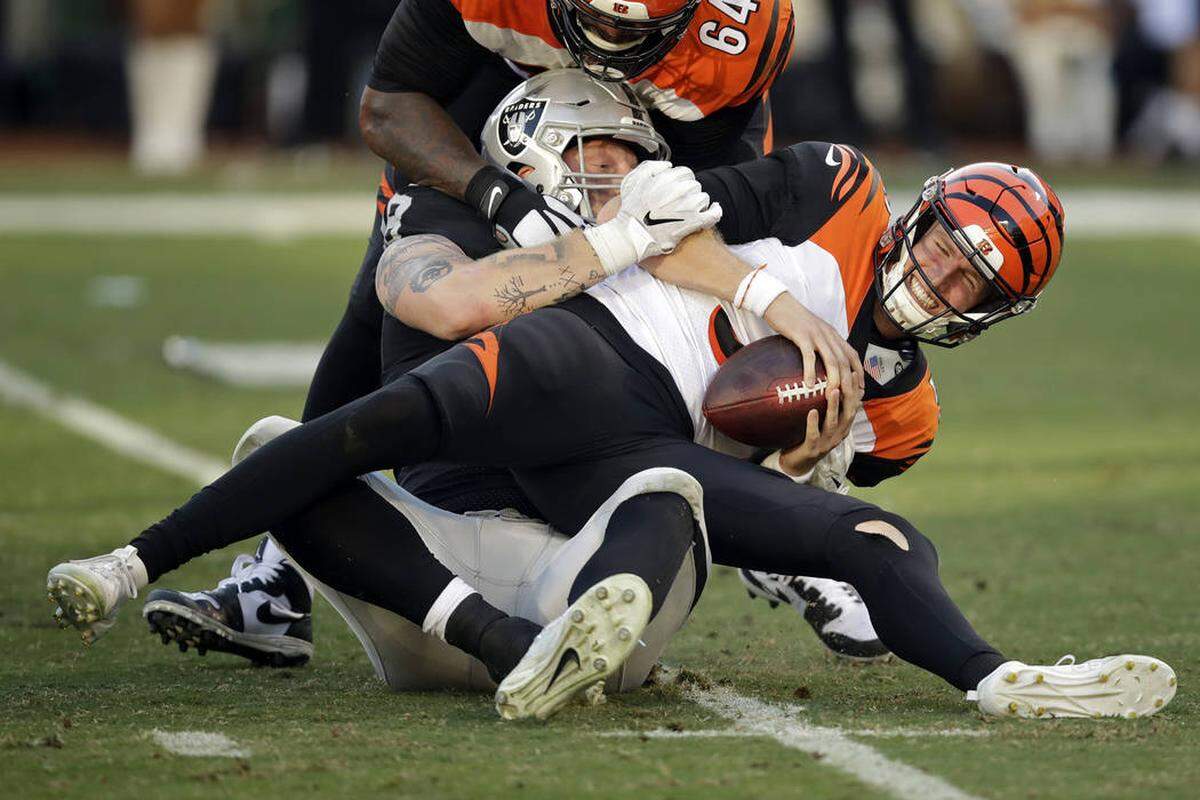 Raiders defensive end Maxx Crosby sacks former Cincinnati Bengals quarterback Ryan Finley in a game in 2019.