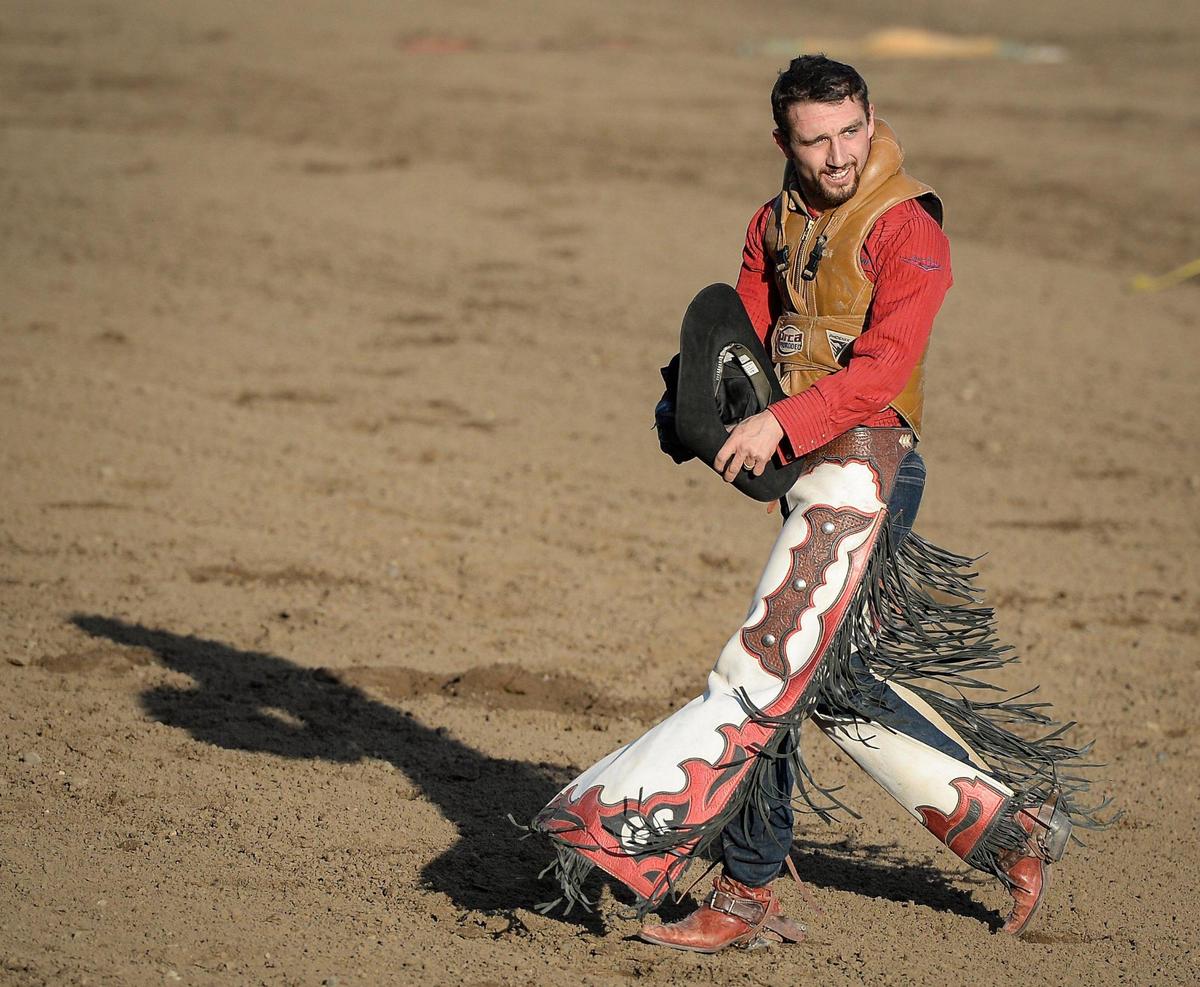 Garrett Shadbolt of Merriman, NE, appears pleased after riding Jericho in the bareback riding section of the PRCA event at the Clovis Rodeo on Thursday, April 23, 2021.