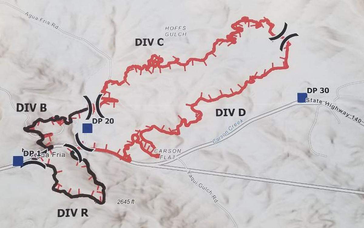 A Cal Fire map of the Agua Fire west of Mariposa shows black lines where the fire is contained at its western end, at left, but red lines around the uncontained northern and eastern areas of the fire, on Tuesday, July 19, 2022. The town of Mariposa is to the east.