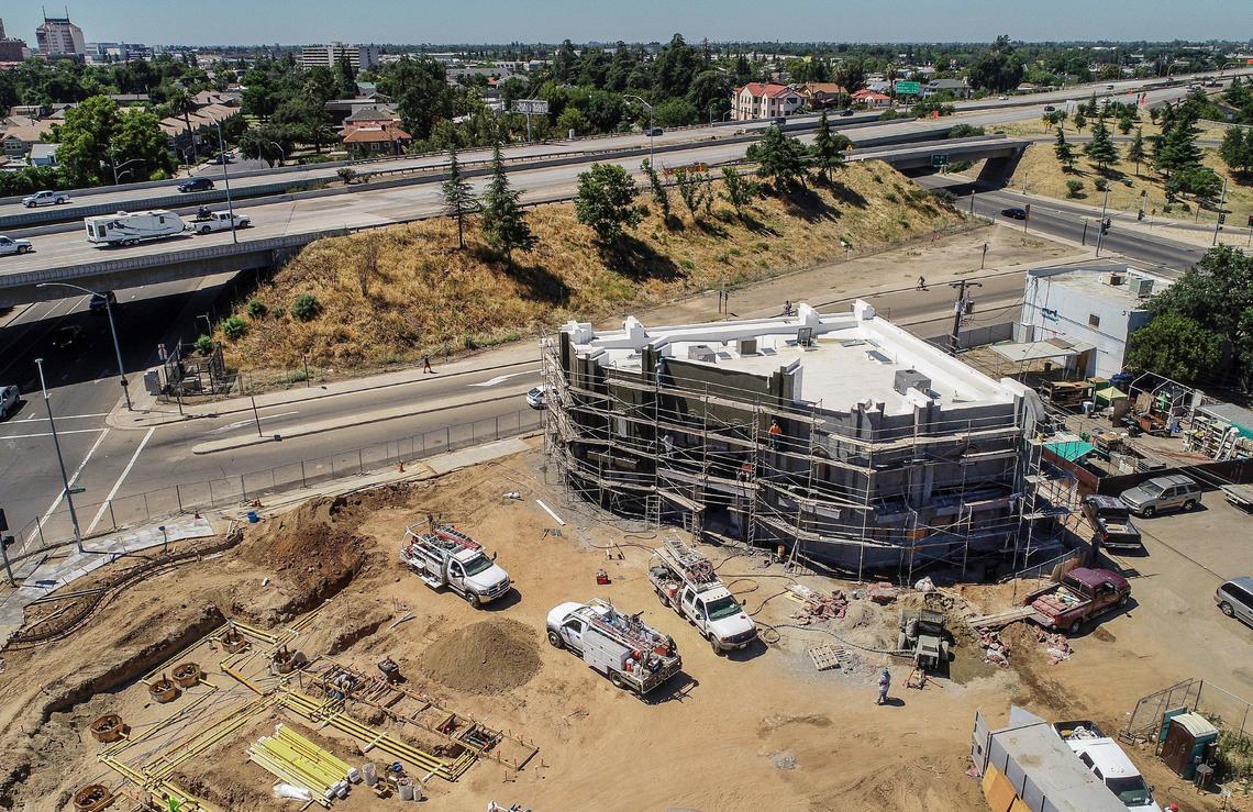 Construction is shown on a building that will be a Johnny Quik with a Chevron station, a Subway restaurant and a Rare Earth Coffee inside at Van Ness and Belmont near the Highway 180 freeway near downtown Fresno on Thursday, Jun 20, 2019.