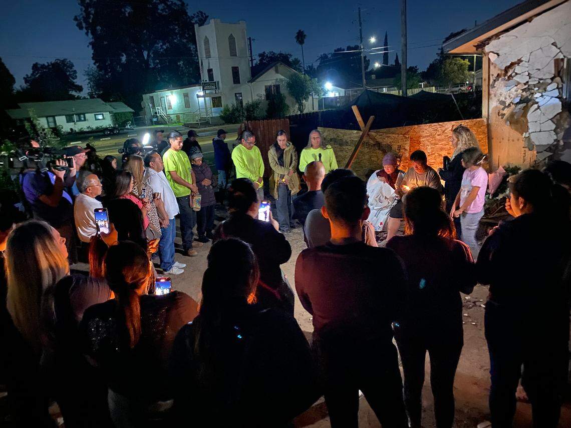 Mourners gather at the home where two sisters died following a pursuit crash on Wednesday, Oct. 16, 2024 in Fresno, California. Mang and Eliza Yang were in the bedroom when the vehicle crashed through the wall.