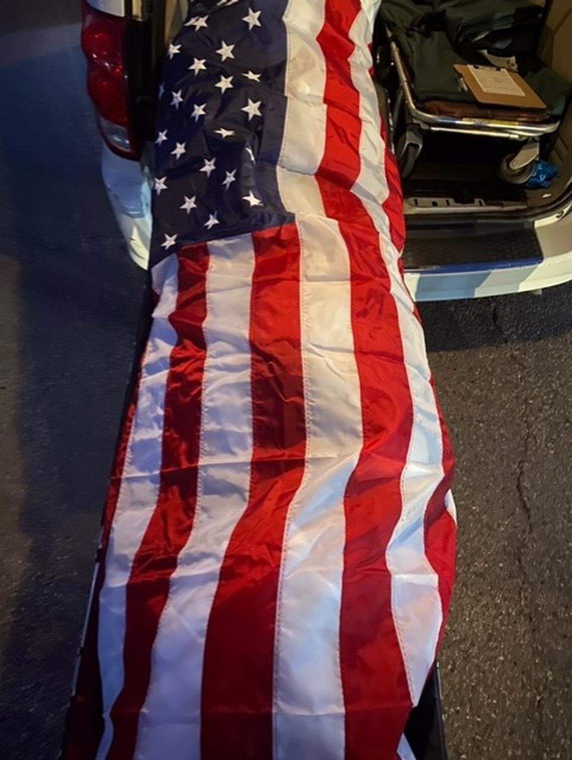 An American flag was draped over the body of Paul Sheykhzadeh in honor of his service to Washoe County Search and Rescue.