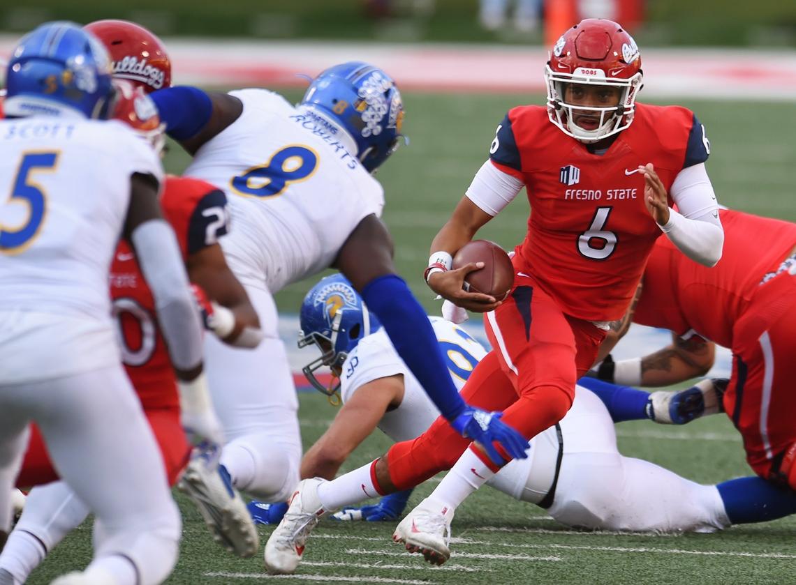 Fresno State quarterback Marcus McMaryion, center, runs through the San Jose State defense in the Bulldogs’ 31-13 victory over the Spartans Saturday, Nov. 24, 2018 in Fresno. McMaryion after a slow start completed 20 of 29 passes for 317 yards and two touchdowns.