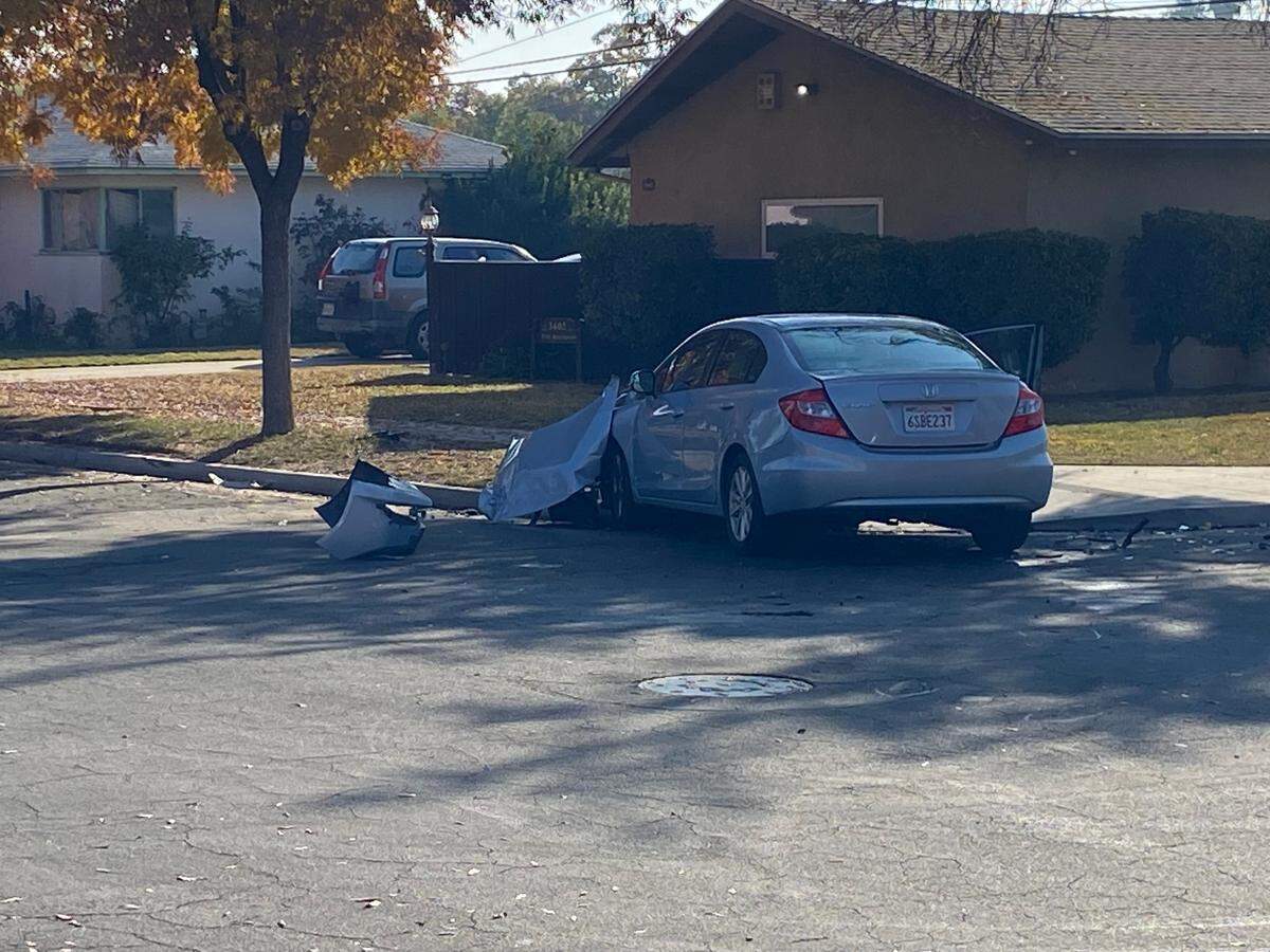 Fresno police investigate a scene after a pursuit that ended in a crash on Michigan near Bond avenues on Tuesday, Nov. 22, 2022.