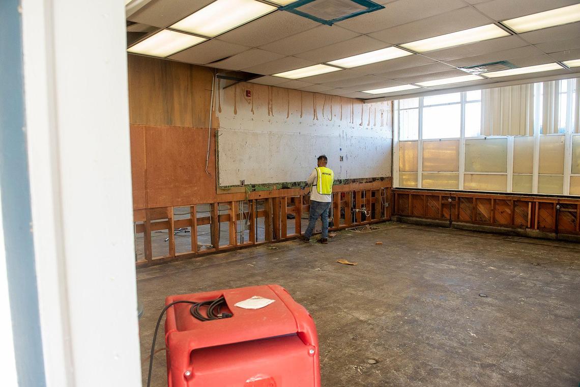 Crews work to repair a building damaged by flooding at Planada Elementary School in Planada, Calif., on Wednesday, Feb. 8, 2023. Many classrooms and buildings at the school as well as homes and businesses throughout the community were damaged by January flooding which forced thousands to evacuate the town.