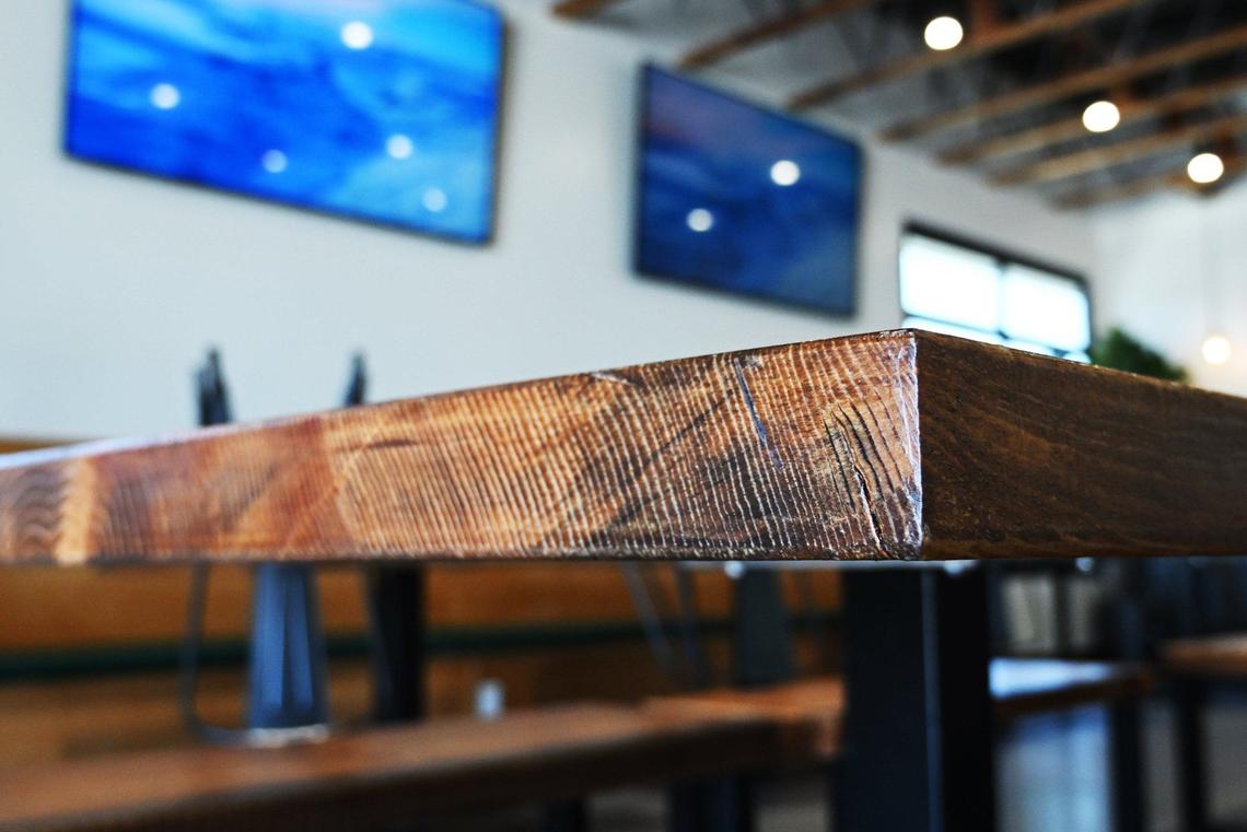 Wood salvaged from forest fires near Shaver Lake have been used to create tables at chef Rob Vieira and Andrew Penn’s new The Third Place Global Eatery, located in the former Franco’s Mexican restaurant location along Pollasky Avenue in Clovis.