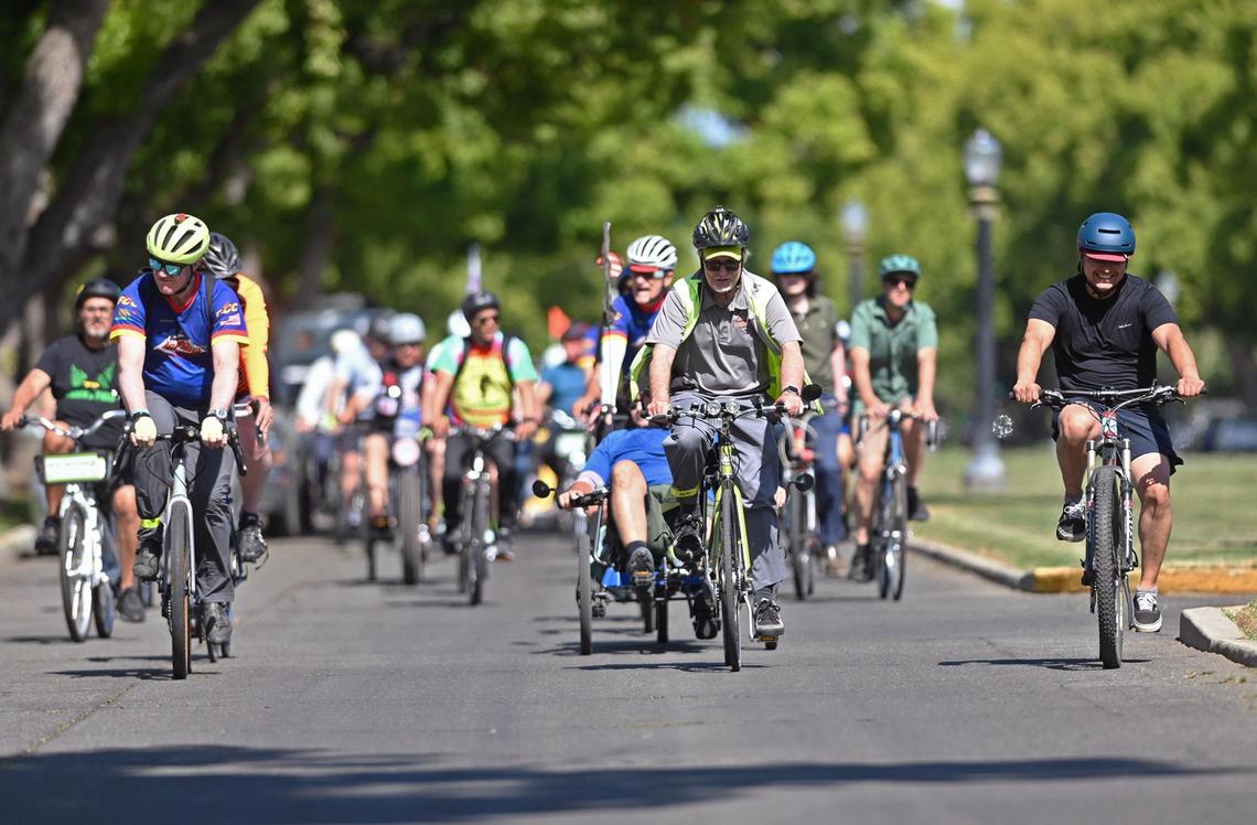 Cyclists ride westbound along Huntington Blvd on a Bike Ride with the Mayor event to help kickstart May as Bike Month, Wednesday, May 10, 2023 in Fresno.