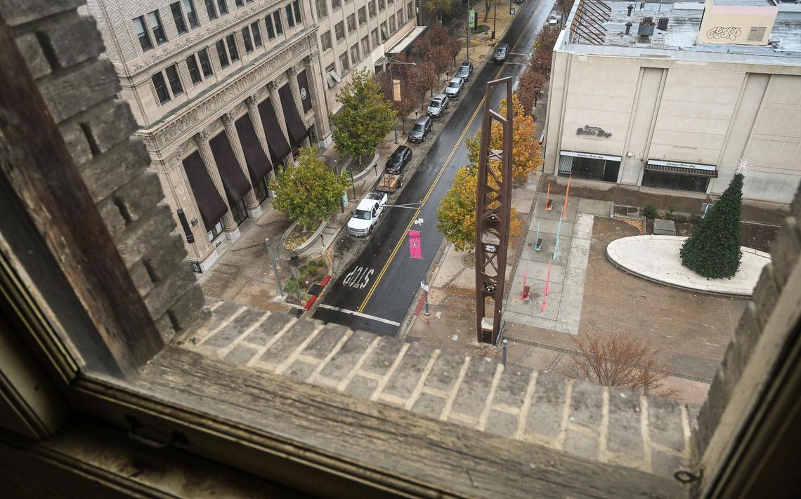 The historic Fulton Clock Tower in downtown Fresno’s Mariposa Plaza comes into view out the window of an eighth floor window of the historic Helm Building on Thursday, Dec. 1, 2022. Sevak Khatchadourian, who has successfully renovated the Pacific Southwest Building, is hoping to develop the Helm Building with new micro apartments.