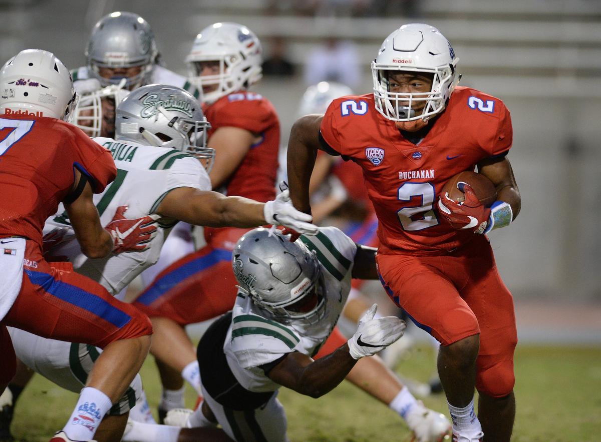 Buchanan’s Kendall Milton runs against De La Salle during their 2018 game.