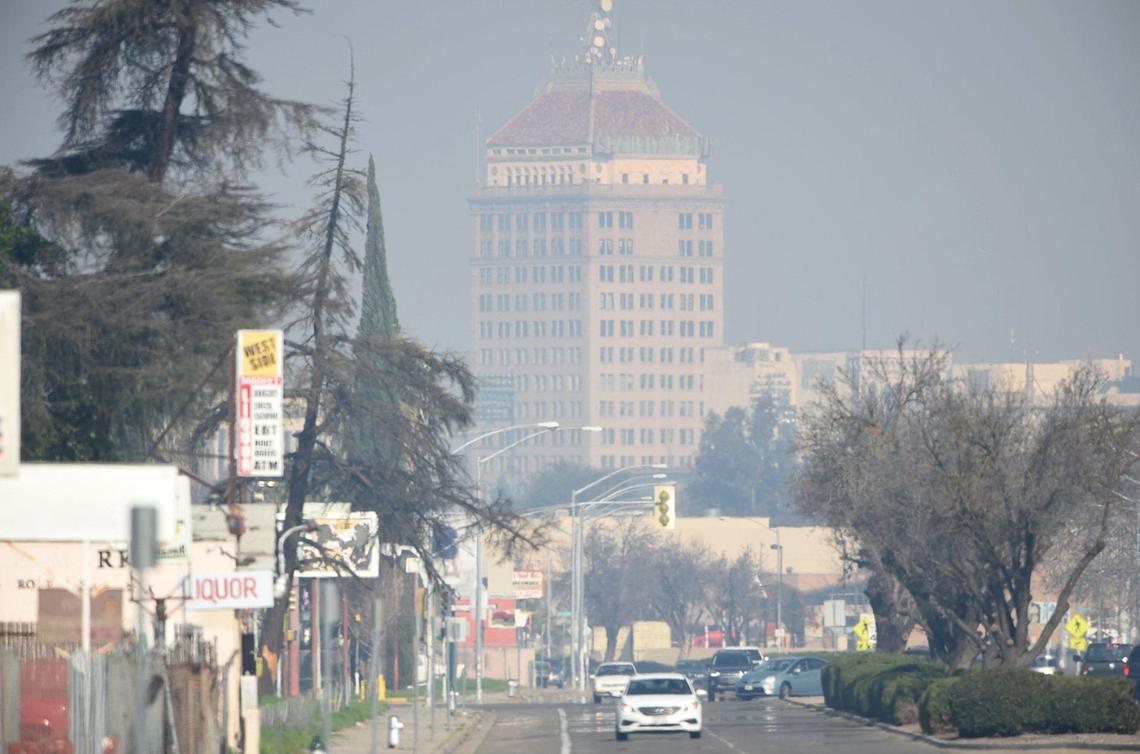 Pacific Southwest Building looms out of the bad air, Jan. 25, 2019, looking north on Elm Avenue.