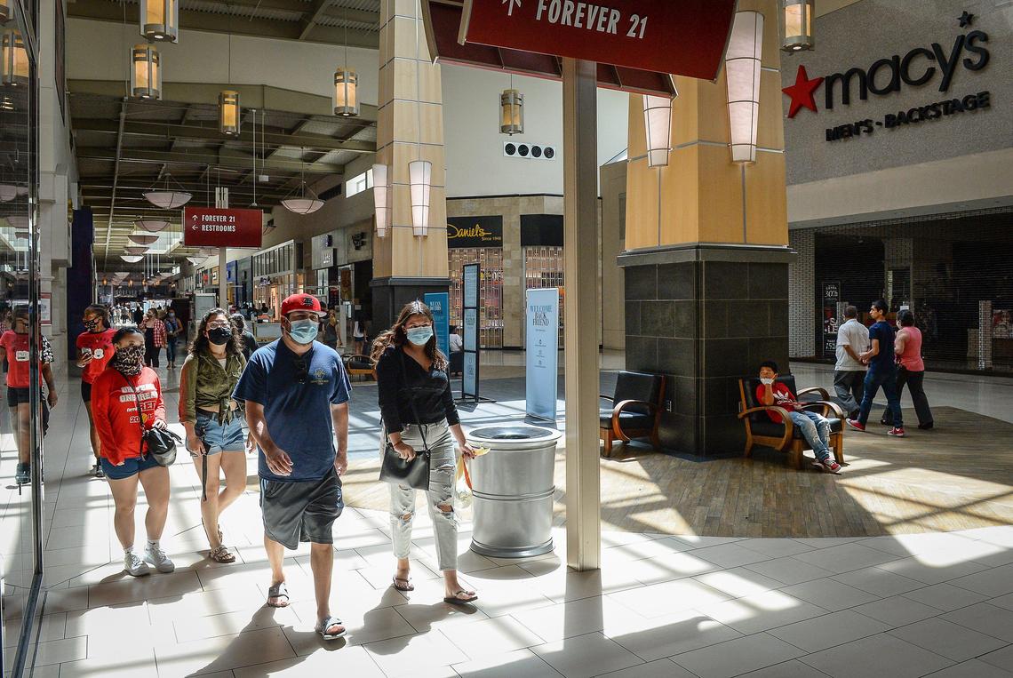 Customers walk through Fashion Fair Mall after the doors opened on Tuesday, May 26, 2020, for the first time since late March due to the coronavirus pandemic.