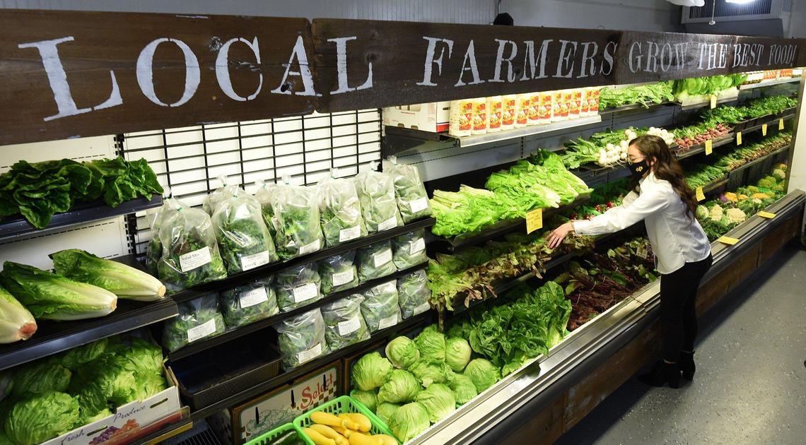 Kellie Vela, manager of the ShepÕs Club Farmers Market, arranges locally sourced produce, Tuesday Jan. 5, 2020. ShepÕs Club, the former historic ShepherdÕs Inn, now hosts different businesses, such as a cafe, deli, farmerÕs market, thanks to undercover work by designer Elaine Culotti of the Undercover Billionaire TV show.