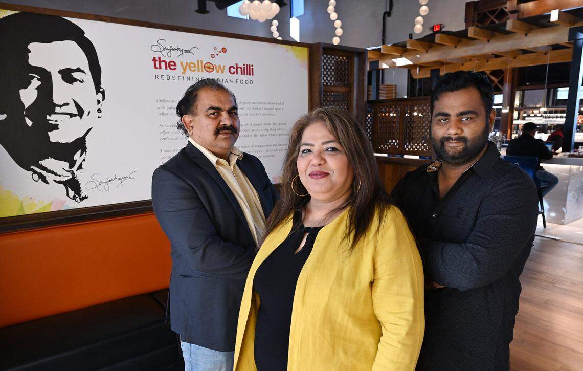 Satvinder Ghotra , left, his wife Kamal Kaur, center, and Smit Shah, right, are the franchise owners of The Yellow Chilli which has just opened on North Palm Avenue in Fresno. Photographed Wednesday Jan. 7, 2026.