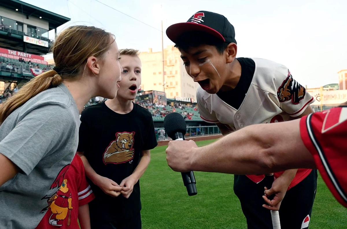 Children shout out “Play Ball!” into the microphone as the Fresno Grizzlies begin the 2023 season home opener against the Stockton Ports Tuesday, April 11, 2023 in Fresno. The Grizzlies lost the first game 5-4 to the Ports, the first in a six-game home series.