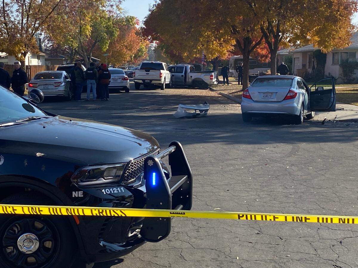 Fresno police investigate a scene after a pursuit that ended in a crash on Michigan near Bond avenues on Tuesday, Nov. 22, 2022.