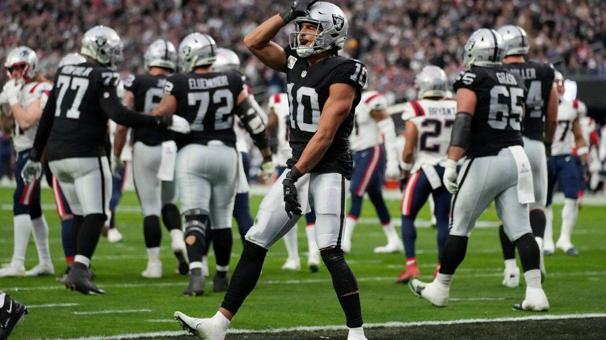 Las Vegas Raiders wide receiver Mack Hollins celebrates after a touchdown reception during the first half of an NFL game between the New England Patriots and Las Vegas Raiders, Sunday, Dec. 18, 2022, in Las Vegas.