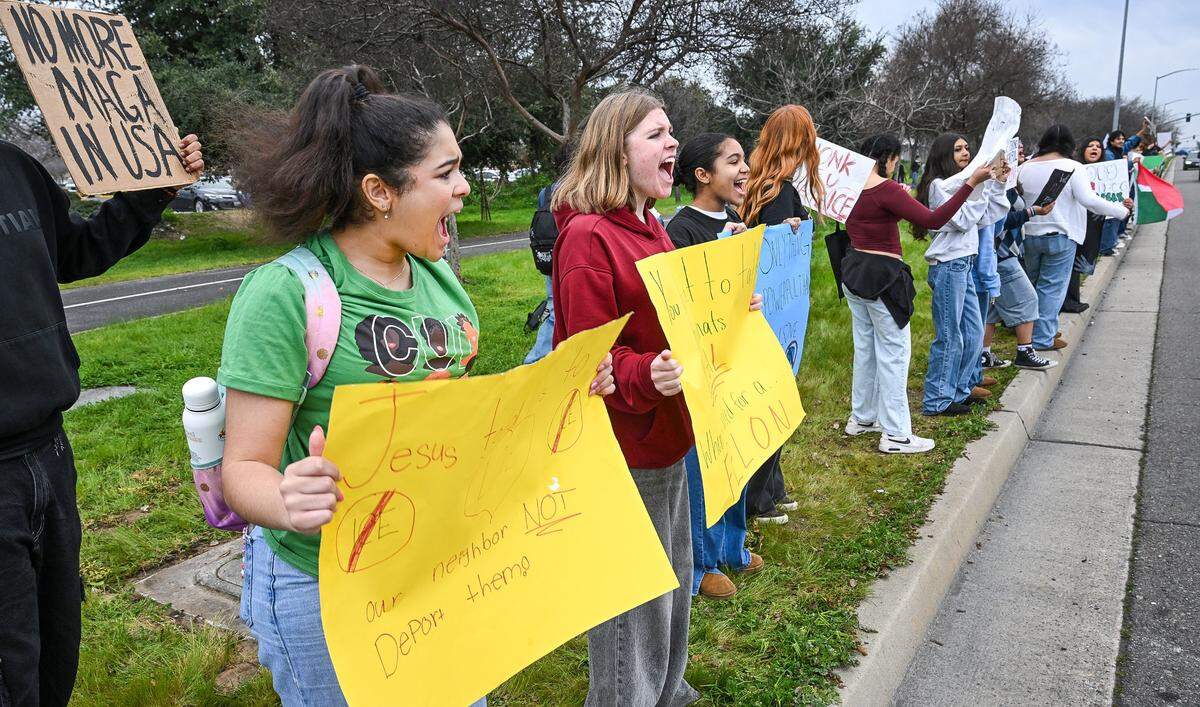 Students from Clovis Unified schools hold signs while protesting ICE enforcement on the corner of Shaw and Clovis avenues on Tuesday, Feb. 10, 2026. Several hundred students from area high schools and even Clark Intermediate were expected to attend the protest throughout the day. 