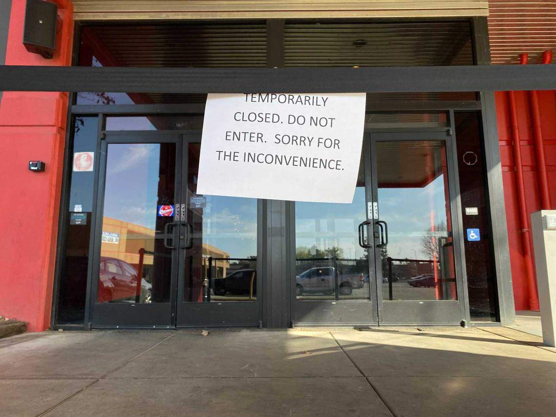 A sign in front of the Bowlero bowling alley at Blackstone and Sierra avenues in Fresno, California alerts customers on Feb. 12, 2022, of its temporary closure a day after a deadly shooting outside the business.