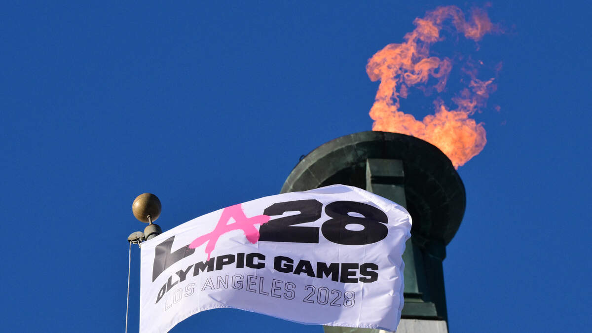 The LA28 Olympic cauldron is lit during a ceremonial lighting at the Memorial Coliseum in Los Angeles on January 13, 2026, ahead of the launch of ticket registration for the 2028 Summer Olympic Games. (Photo by Frederic J. Brown / AFP via Getty Images)