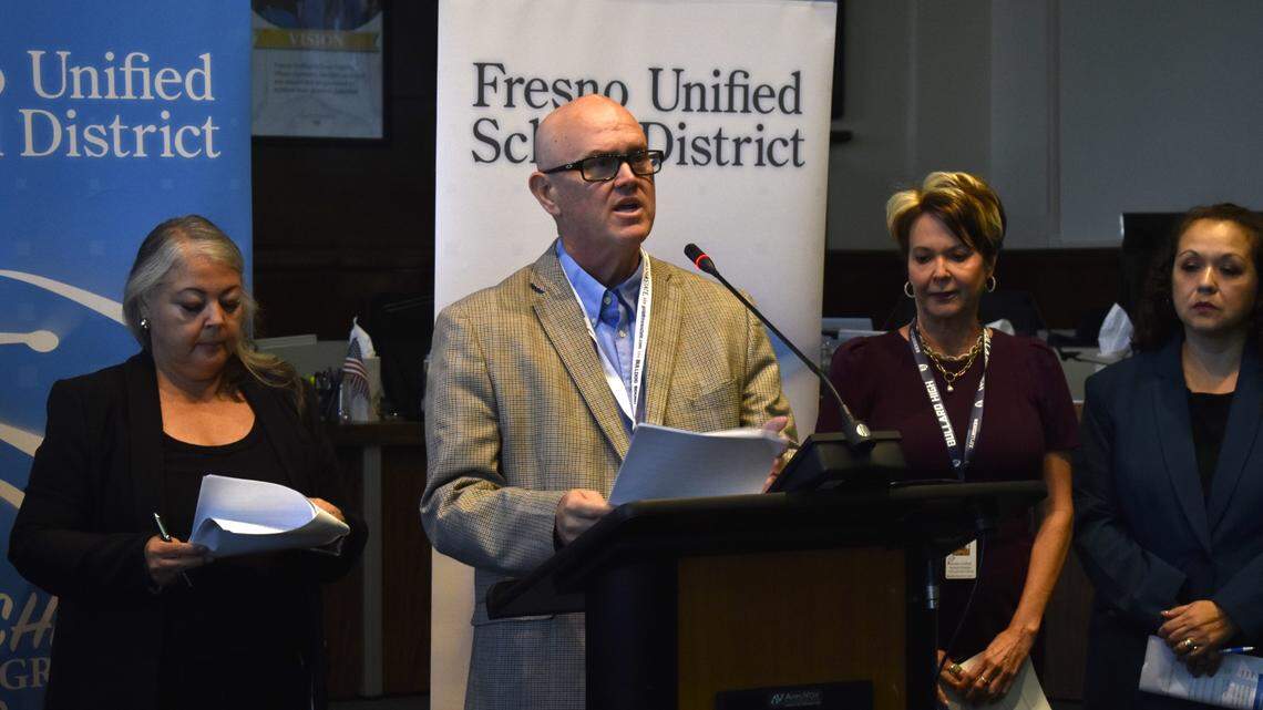 Fresno Unified School District Superintendent Bob Nelson is flanked by school board members at a 2023 news conference.