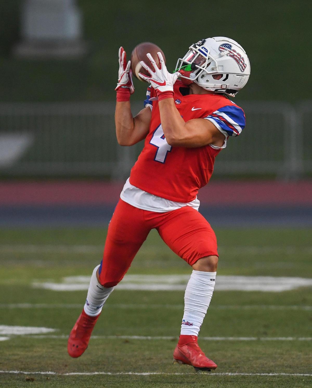 Buchanan’s Hilton Green hauls in a pass from quarterback Jayden Mandal for a first down against Bakersfield in their game at Veterans Memorial Stadium on Friday, Aug. 19, 2022.