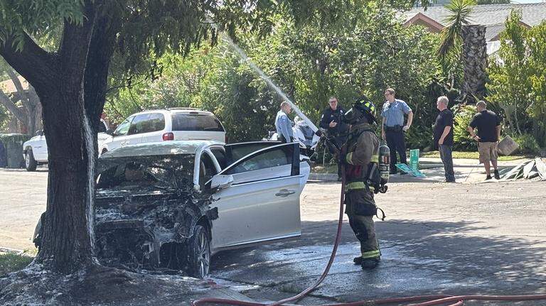Driver slams into tree in Fresno, igniting fire. They fled the scene, police say
