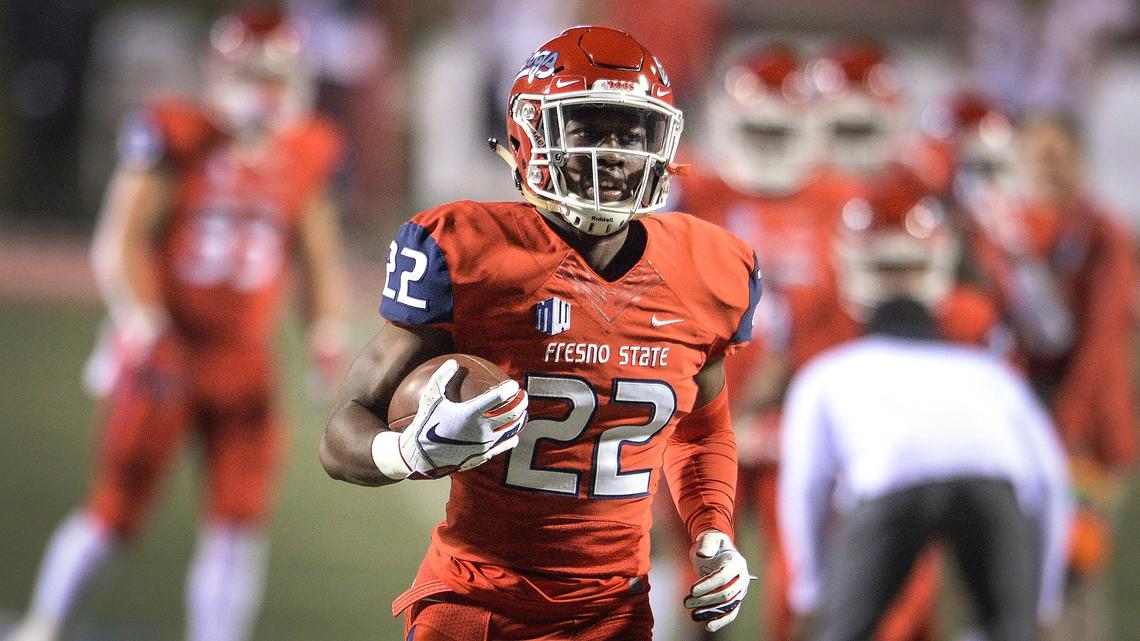 Fresno State’s Jordan Mims runs with the ball during warm-ups before the start of their game against San Diego State at Bulldog Stadium in Fresno on Saturday, Nov. 17, 2018.