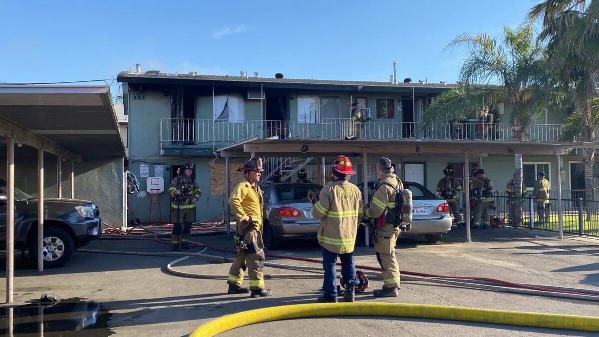 The Fresno Fire Department battles an apartment fire that spread to an attic on Sunday, April 30, 2023. Nineteen people were displaced.
