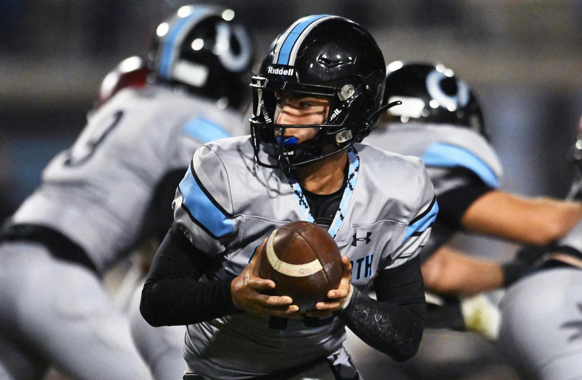 Clovis North quarterback Mario Cosma, prepares to handoff in a Central Section Division I quarterfinal game against Clovis West Thursday, Nov. 9, 2023 in Clovis.