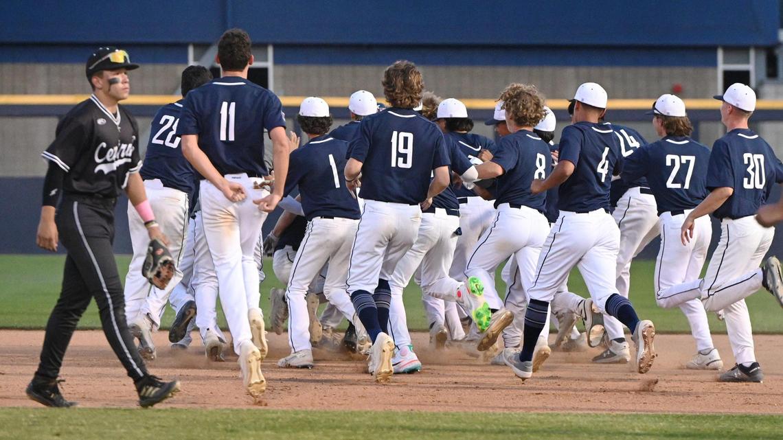 Clovis East players run onto the field to celebrate their walk-off walk against Central to win the Central Section Division II baseball championship game at Pete Beiden Field on Friday, May 27, 2022.