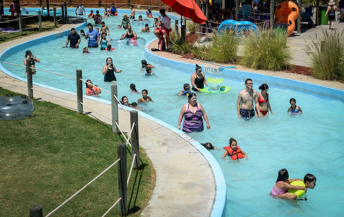 Visitors meander in the cool water along the Waimea Lazy River at Island Waterpark on a hot afternoon in Fresno on Saturday, July 27, 2019.