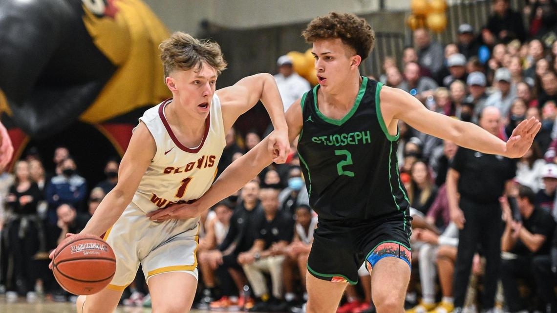 Clovis West’s Jackson Young, left, tries to drive around St. Joseph’s Luis Marin during their Central Section Open Division championship game at Clovis West on Saturday, Feb. 26, 2022.
